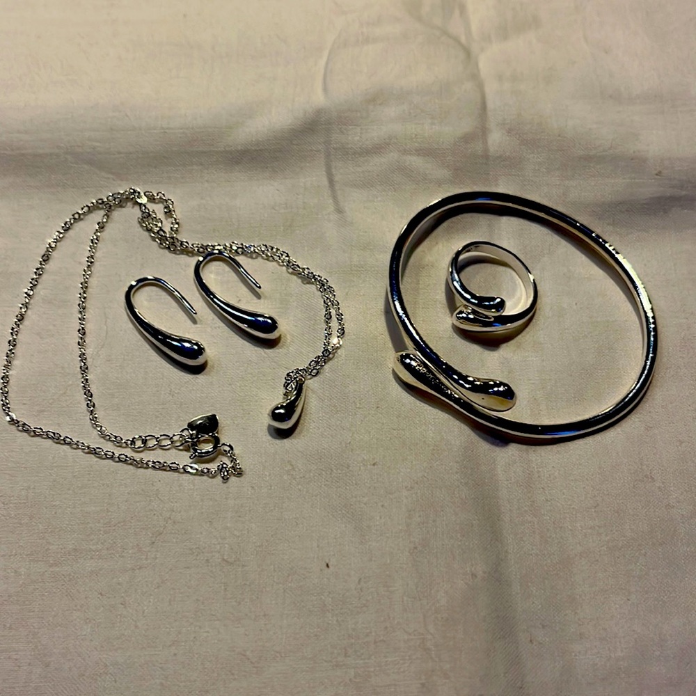 New silver set-necklace, earrings, ring, and bracelet